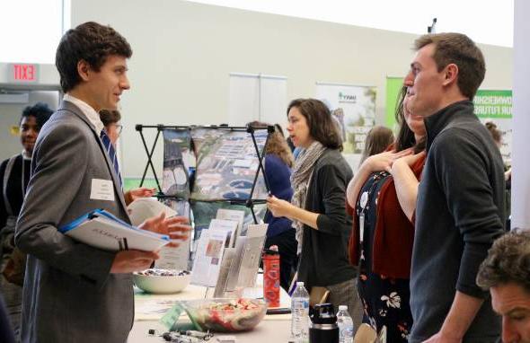 Students and employers interact at a career fair.